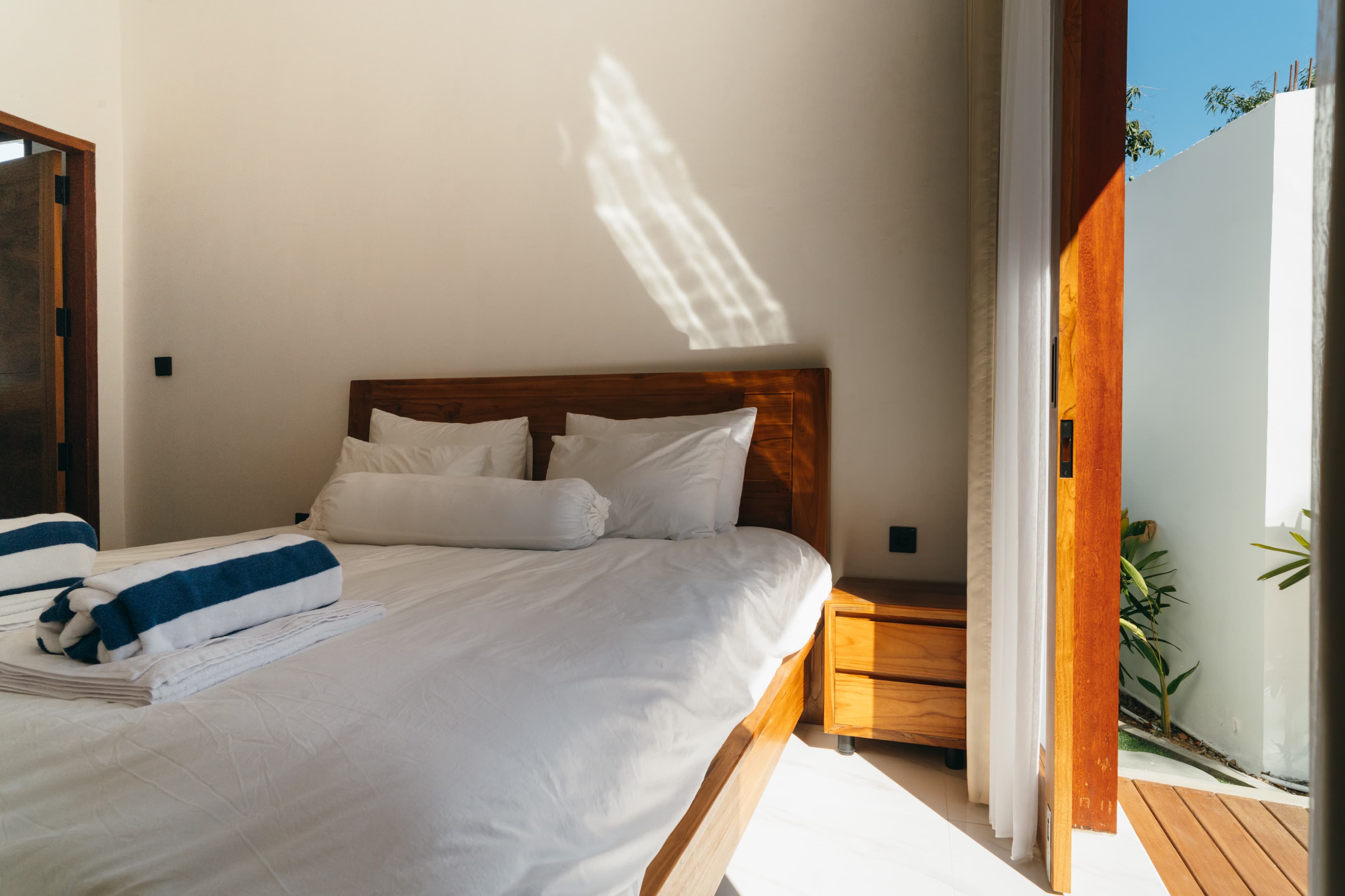 Sunlight hitting the bedroom deck door